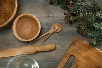 Baking Christmas cookie in rustic kitchen - dough recipe ingredients (eggs, flour, milk, butter, sugar) on planked wooden table from above. Background layout with free text space.