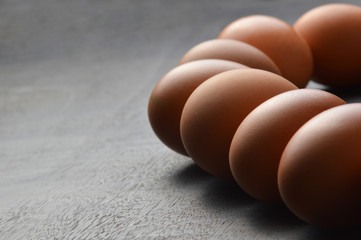 Group of eggs on the black wood background 