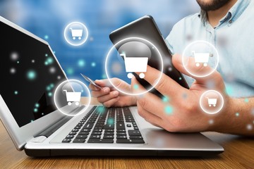 Man with laptop and credit card. On-line shopping on the internet using a laptop