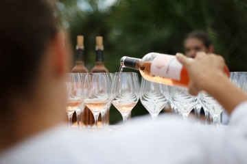 pouring wine in glasses