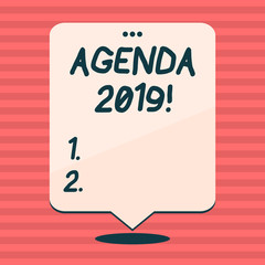 Writing note showing Agenda 2019. Business concept for list of items to be discussed at formal meeting or event White Speech Balloon Floating with Three Punched Hole on Top