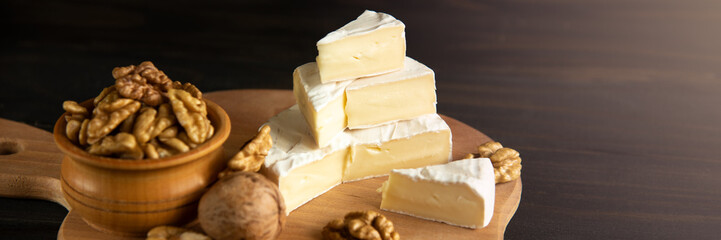 Cheese camembert or brie with walnut kernels