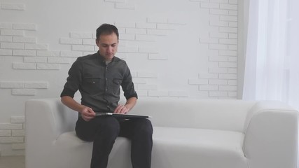 Business man closing laptop and finishing work