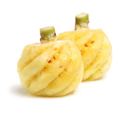 Ripe pineapple peeled on white background