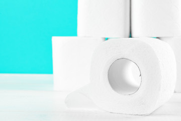 Toilet paper rolls on turquoise bright background