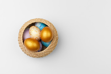 Colored easter eggs in a basket