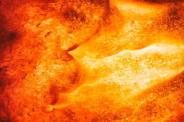 Abstract background. Fake volcano interior with melting rock and fire.