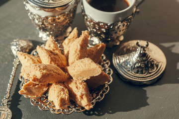 Turkish sweets with coffee on a wooden table
