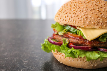 Tasty fresh burger on table, closeup
