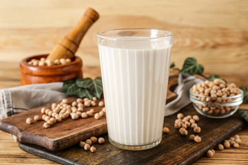Glass of healthy soy milk on table