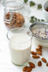 Glass of healthy almond milk on table