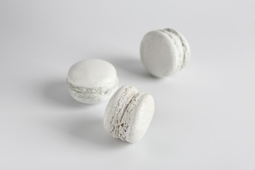 White macarons on light background