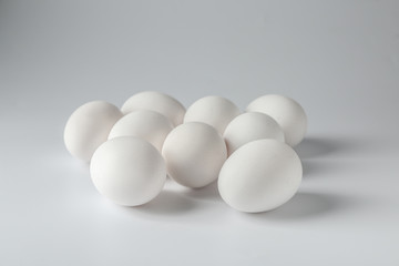 Tasty raw eggs on white background