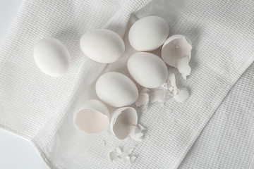Fototapeta na wymiar Tasty raw eggs on white napkin