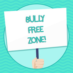 Word writing text Bully Free Zone. Business photo showcasing creating abuse free school college life Hand Holding Blank White Placard Supported by Handle for Social Awareness