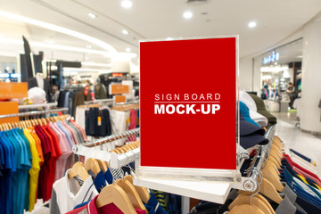 Mock up sign board in fashion clothes shop
