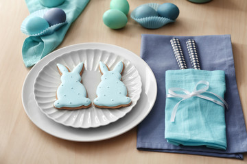 Easter table setting with cookies in shape of bunnies