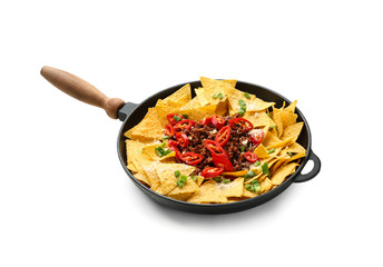 Frying pan with tasty nachos, minced meat and chili on white background