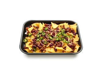 Baking dish with tasty nachos, beans, minced meat and chili on white background