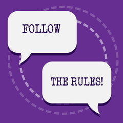 Word writing text Follow The Rules. Business photo showcasing go with regulations governing conduct or procedure Two Blank White Speech Balloon Engaging in Conversation on Pastel Backdrop