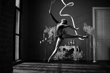 Girl gymnast, performs various gymnastic and fitness exercises. The concept of childhood and sport,...