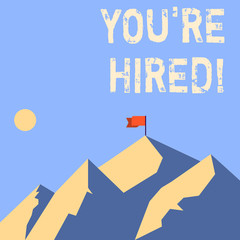 Word writing text You Re Hired. Business photo showcasing Used by huanalysis resources indicate employee that he is got job Mountains with Shadow Indicating Time of Day and Flag Banner on One Peak