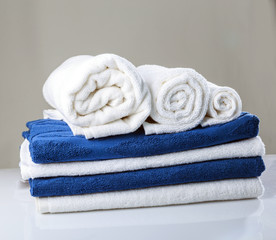 Obraz na płótnie Canvas Stacked Rolled Bath Towels