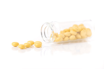 Yellow pills with glass bottle