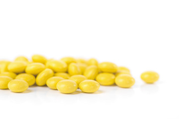 Closeup of yellow pills isolated
