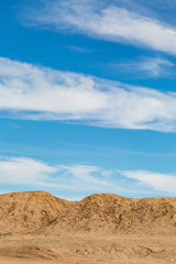 Fototapeta na wymiar Clouds over a desert landscape, in California