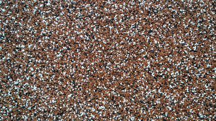 background in the form of colored plaster of small pebbles