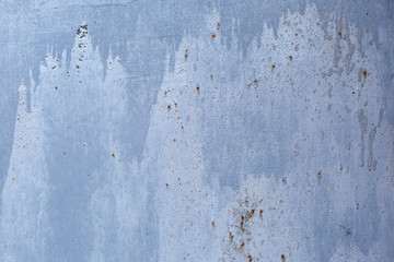 Textured background painted blue color of an old metal surface with traces of rust.