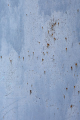 Textured background painted blue color of an old metal surface with traces of rust.