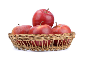 Apples in Wicker Basket. Isolated on White Background.