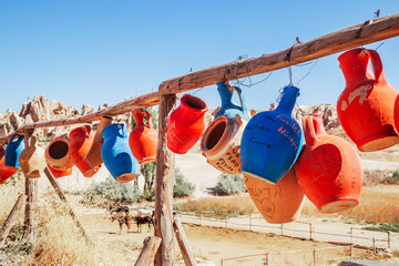 Decorative old jugs on the tree.