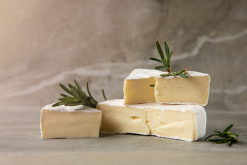 Cheese camembert or brie with fresh rosemary