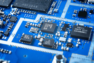 Macro shot of Circuit board with resistors microchips and electronic components. Computer hardware...