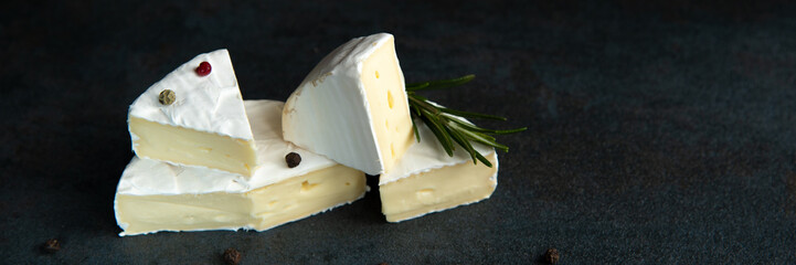 Cheese camembert or brie with fresh rosemary
