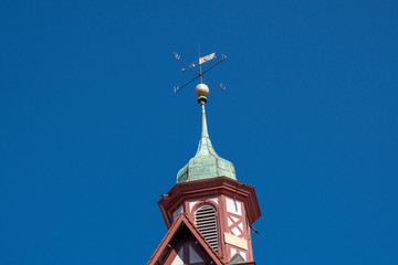 Fototapeta na wymiar Church tower with weathercock and tin roof