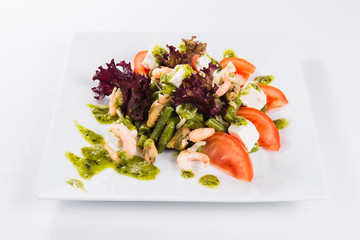 Salad which is beautifully decorated with green sauce