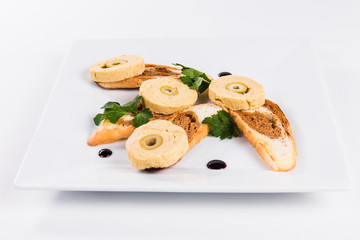 Black and white bread with meat roll and olives