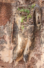 Ruined standing Buddha statue