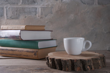 Cup of coffee and books