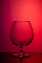 vertical image of glass on colored background