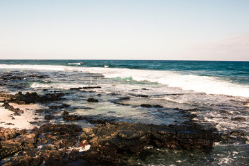 Fototapeta na wymiar Ocean Waves on Island Coast and Shoreline Landscape Nature Photo