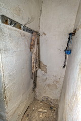 old clothes hook with a dirty worn shirt