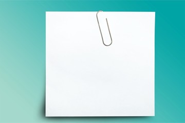 Close up of a crumpled unfolded piece of paper on white background