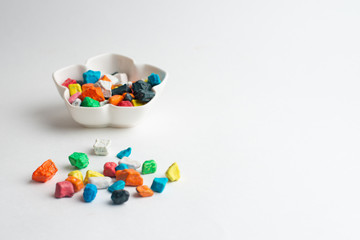 A bowl of multicolor chocolate candies