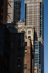 Close-up view of old and modern skyscrapers in Financial District Lower Manhattan New York City