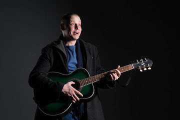 Naklejka premium Young man with a guitar